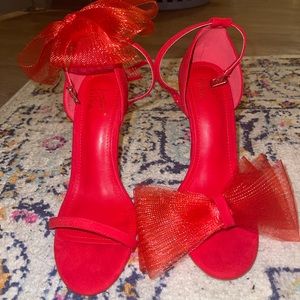 asymmetric red bow heels